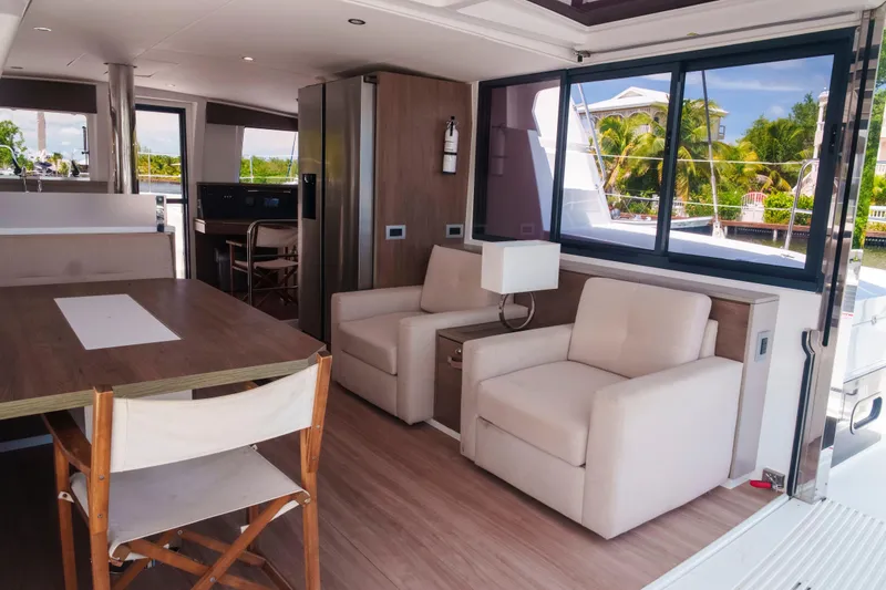 Slide: The Image of Luxurious interior of 2023 Bali 4.4 yacht with modern seating and large windows. - 17