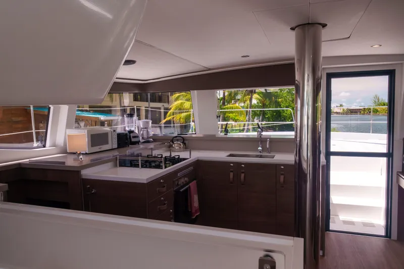 Slide: The Image of Modern kitchen interior on 2023 Bali 4.4 yacht with appliances and scenic window view. - 23