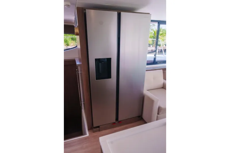 Slide: The Image of Modern kitchen with stainless steel refrigerator in 2023 Bali 4.4 model yacht interior. - 24