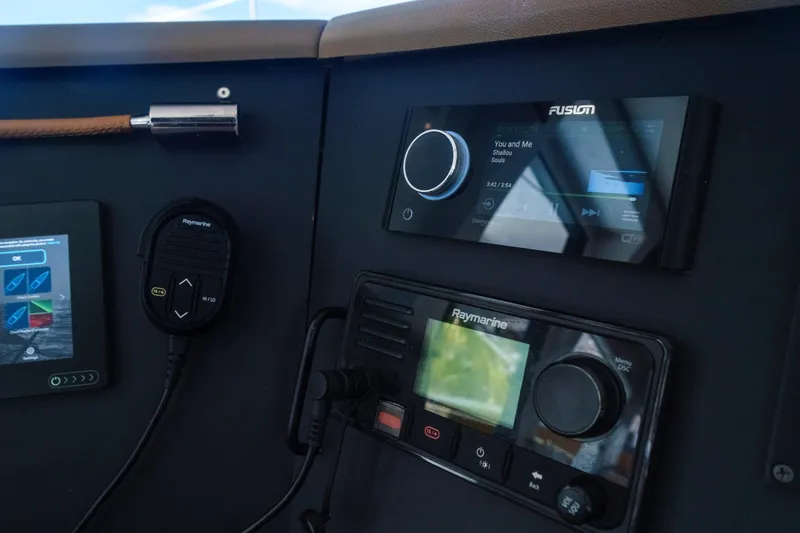 Slide: The Image of Control panel of a 2023 Bali 4.4 yacht with navigation and audio systems. - 26