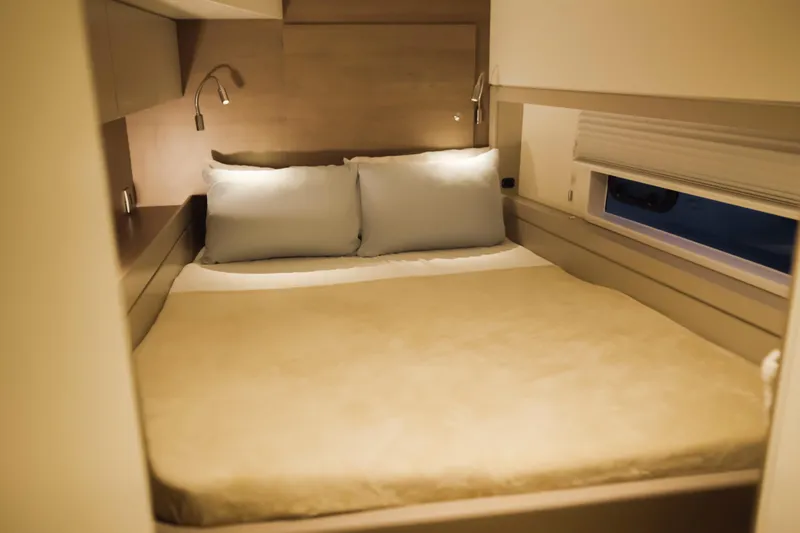 Slide: The Image of Cozy bedroom in 2023 Bali 4.4 model yacht with soft lighting and modern design. - 33