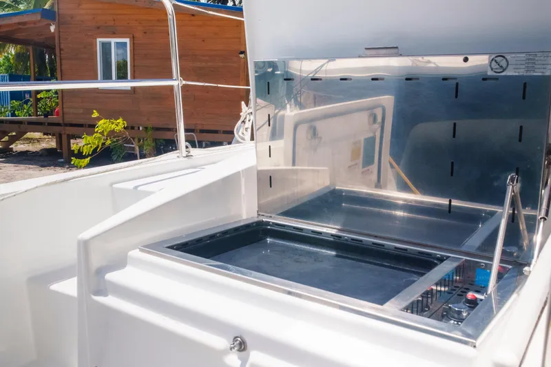 Slide: The Image of Outdoor kitchen on 2023 Bali 4.4 catamaran, featuring a sleek grill and modern design. - 37