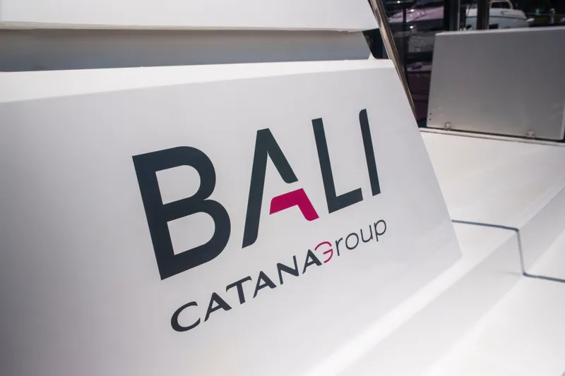 Slide: The Image of Bali 4.4 Catamaran by Catana Group, 2023 model, logo on white surface. - 38