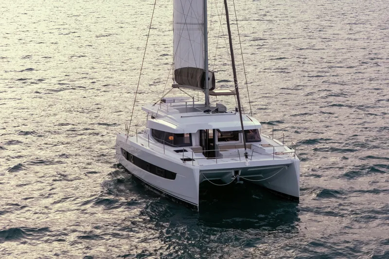 Slide: The Image of 2023 Bali 4.4 catamaran sailing on open sea, showcasing modern design and spacious deck. - 4
