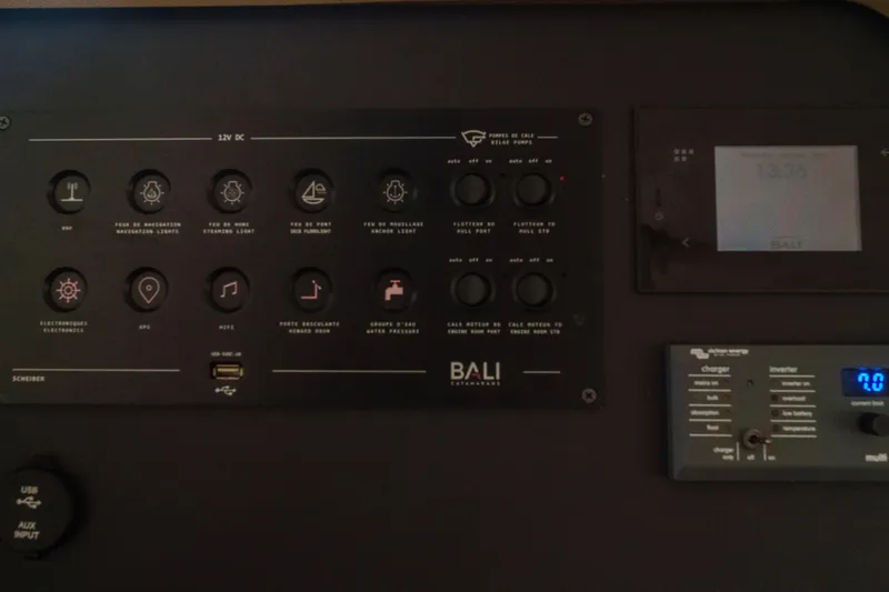 Slide: The Image of Control panel of a 2023 Bali 4.4 catamaran with navigation and system controls. - 46