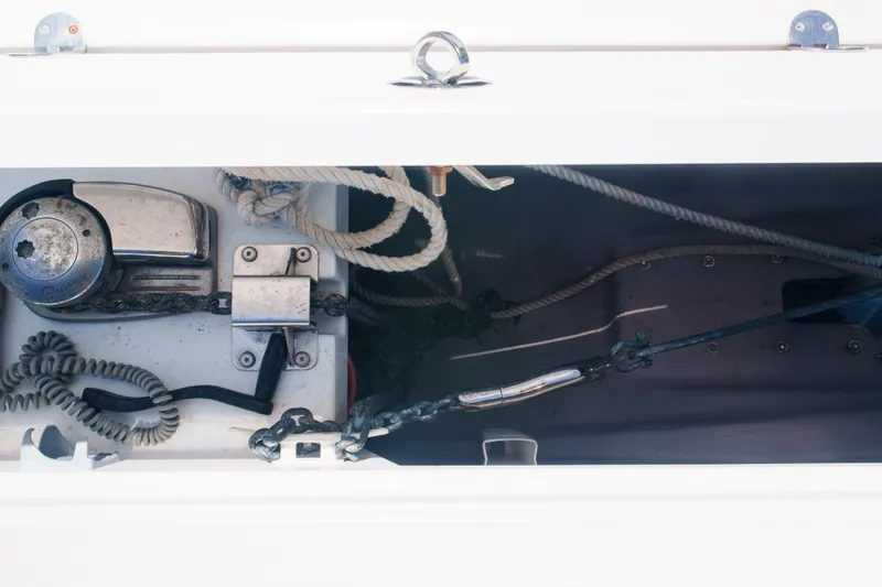 Slide: The Image of Anchor compartment of 2023 Bali 4.4 boat with ropes and winch. - 48