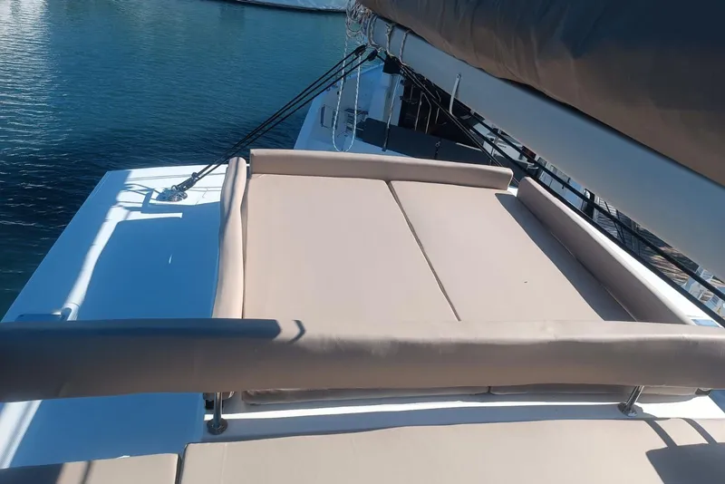 Slide: The Image of Luxurious sunbathing area on 2023 Bali 4.4 yacht, overlooking serene blue waters. - 51