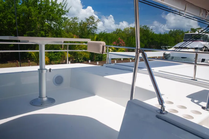Slide: The Image of Modern 2023 Bali 4.4 yacht deck with sleek design and lush greenery background. - 55