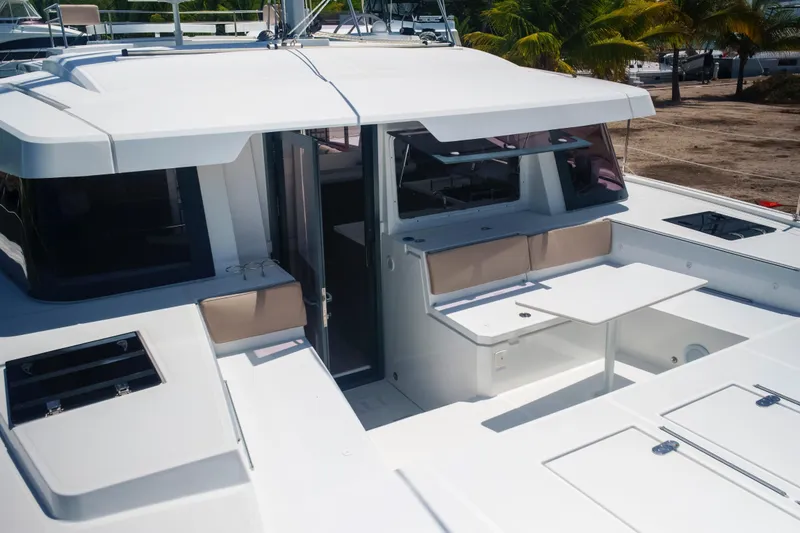 Slide: The Image of 2023 Bali 4.4 yacht deck with seating and table, featuring modern design elements. - 56