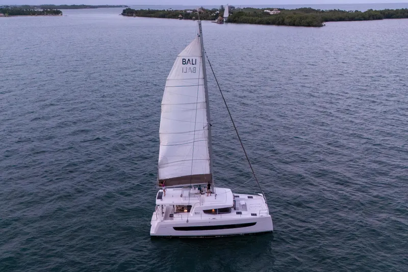 Slide: The Image of Sailing catamaran Bali 4.4, 2023 model, cruising on open water. - 61