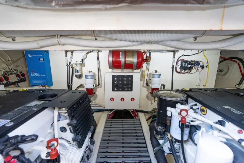 Slide: The Image of Engine room of 2015 Tiara Yachts C44 Coupe with visible machinery and control systems. - 52