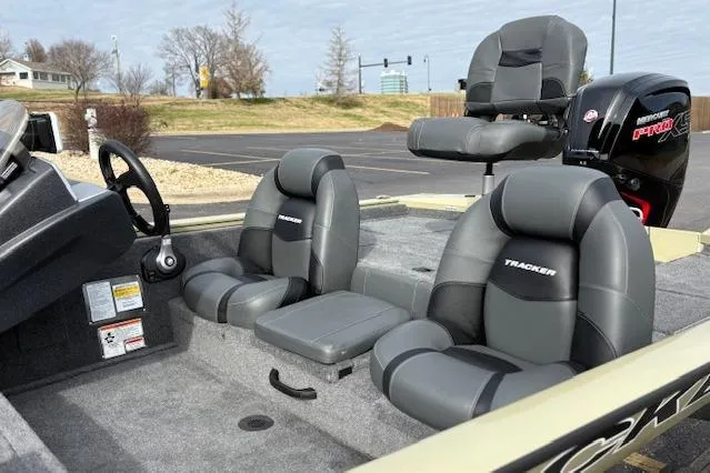 Slide: The Image of 2026 Tracker Pro Team 190 boat interior with gray seating and steering wheel. - 12