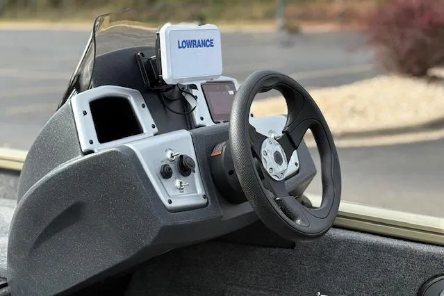Slide: The Image of 2026 Tracker Pro Team 190 boat dashboard with steering wheel and Lowrance navigation system. - 14