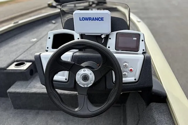 Slide: The Image of 2026 Tracker Pro Team 190 boat dashboard with Lowrance electronics and steering wheel. - 16