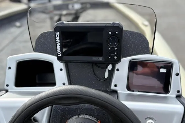 Slide: The Image of 2026 Tracker Pro Team 190 boat dashboard with Lowrance fishfinder and steering wheel. - 19