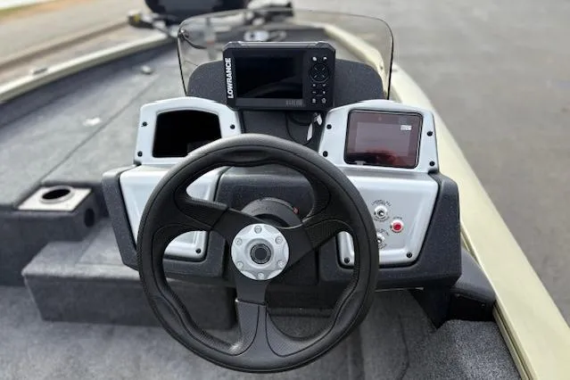 Slide: The Image of 2026 Tracker Pro Team 190 boat dashboard with steering wheel and electronic displays. - 20