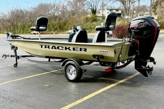 Slide: The Image of 2026 Tracker Pro Team 190 boat with trailer, parked outdoors. - 4