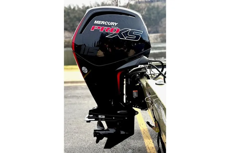 Slide: The Image of 2026 Tracker Pro Team 190 with Mercury Pro XS outboard motor, parked near water. - 9
