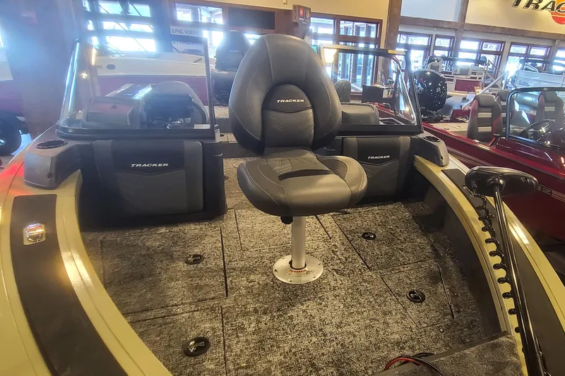 Slide: The Image of 2026 Tracker Targa V-19 Combo boat interior with seating and dashboard. - 2