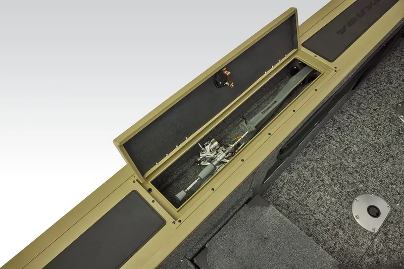 Slide: The Image of 2026 Tracker Targa V-19 Combo boat storage compartment with fishing rod. - 37