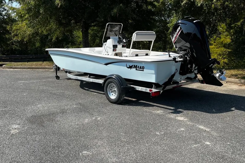 Slide: The Image of 2026 Mako Pro Skiff 17 CC boat on trailer, parked outdoors. - 3