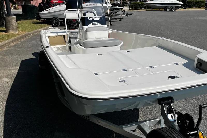 Slide: The Image of 2026 Mako Pro Skiff 17 CC boat on trailer in parking lot. - 7