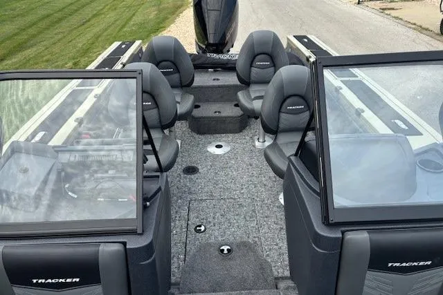 Slide: The Image of 2026 Tracker Targa V-19 Combo boat interior with seating and windshield. - 2