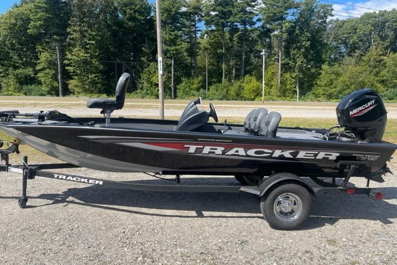 Slide: The Image of 2026 Tracker Pro Team 175 Crappie Edition boat on trailer, parked outdoors. - 3