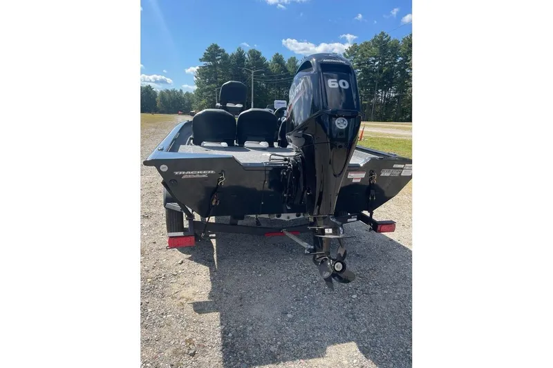 Slide: The Image of 2026 Tracker Pro Team 175 Crappie Edition boat with Mercury 60 engine, parked outdoors. - 5