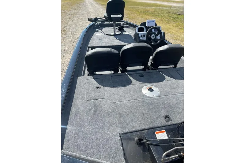 Slide: The Image of 2026 Tracker Pro Team 175 Crappie Edition boat interior with seating and steering console. - 8