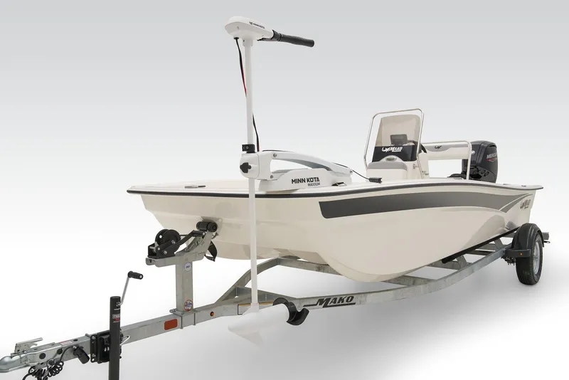 Slide: The Image of 2026 Mako Pro Skiff 17 CC boat console with steering wheel and controls. - 7
