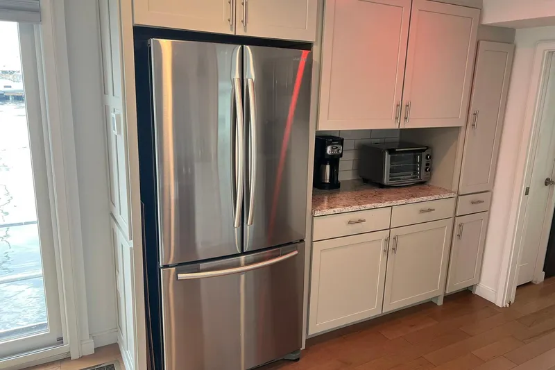 Slide: The Image of Modern kitchen in 1981 Sumerset houseboat with stainless steel fridge and appliances. - 15