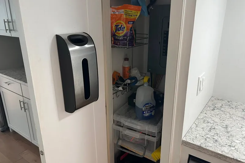 Slide: The Image of Storage closet on 1981 Sumerset houseboat with cleaning supplies and detergent. - 16