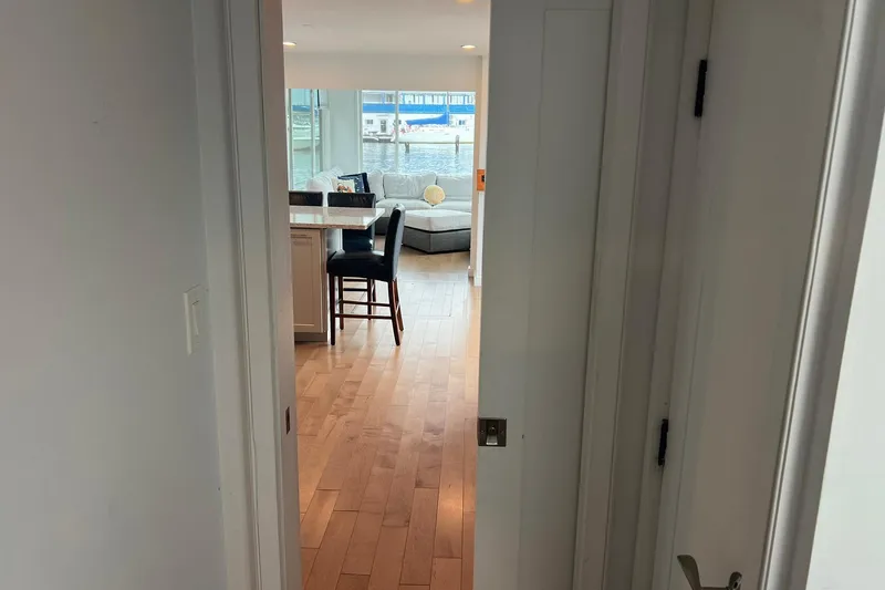 Slide: The Image of Interior view of a 1981 Sumerset houseboat with modern furnishings and wooden flooring. - 18