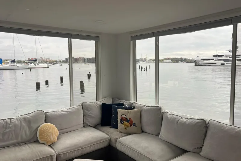 Slide: The Image of Interior view of 1981 Sumerset houseboat with waterfront scenery through large windows. - 3