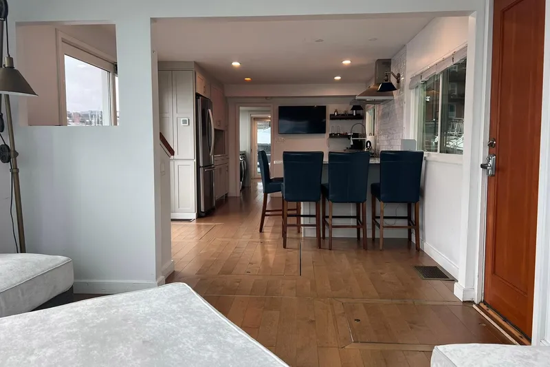 Slide: The Image of Interior of a 1981 Sumerset houseboat with modern kitchen and seating area. - 8