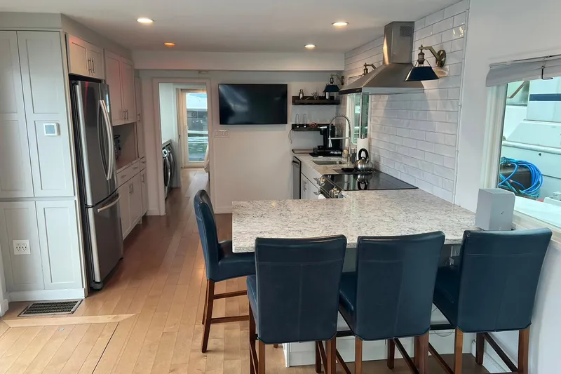 Slide: The Image of Modern kitchen interior on 1981 Sumerset houseboat with sleek appliances and bar seating. - 9