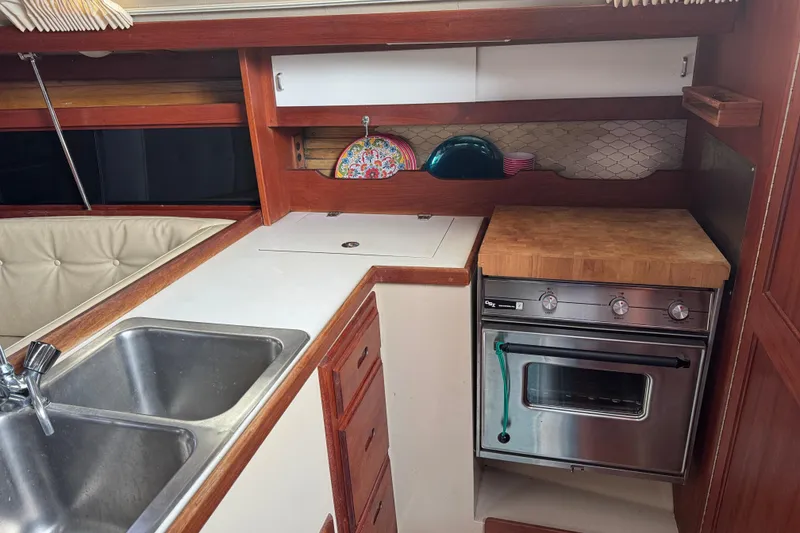 Slide: The Image of Galley kitchen in 1988 Catalina 34 sailboat with sink and oven. - 13