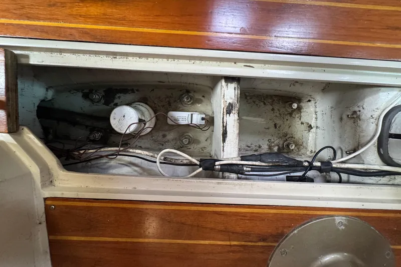 Slide: The Image of Interior view of a 1988 Catalina 34 sailboat showing wiring and components. - 37
