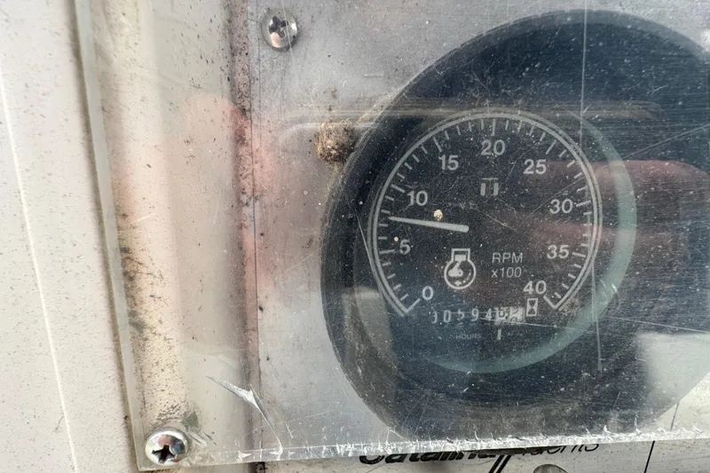 Slide: The Image of Close-up of a Catalina 34 1988 RPM gauge, showing 945 hours. - 39