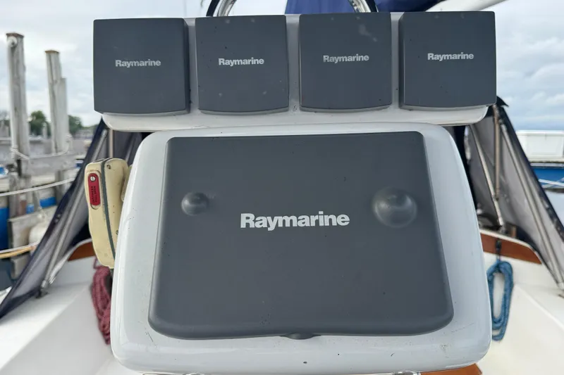 Slide: The Image of Raymarine navigation equipment on a 1988 Catalina 34 sailboat, docked at a marina. - 41