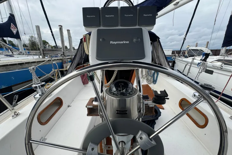 Slide: The Image of Cockpit of a 1988 Catalina 34 sailboat with Raymarine navigation equipment. - 42