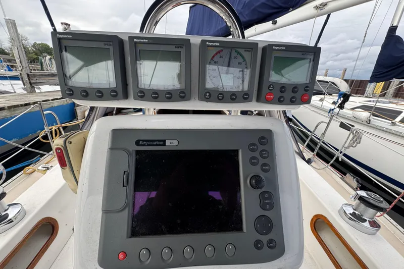Slide: The Image of Cockpit of 1988 Catalina 34 sailboat with Raymarine navigation instruments. - 43