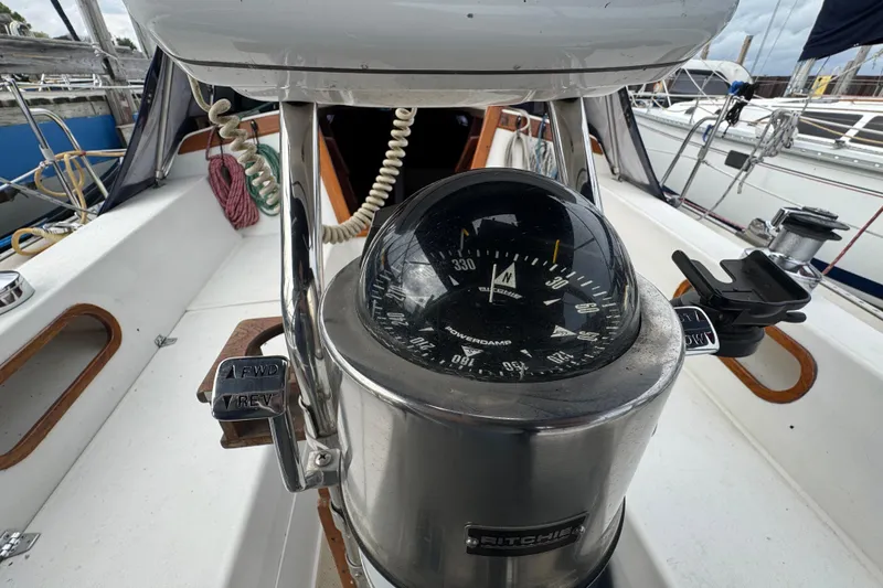 Slide: The Image of Compass on 1988 Catalina 34 sailboat cockpit, featuring navigation and control elements. - 44
