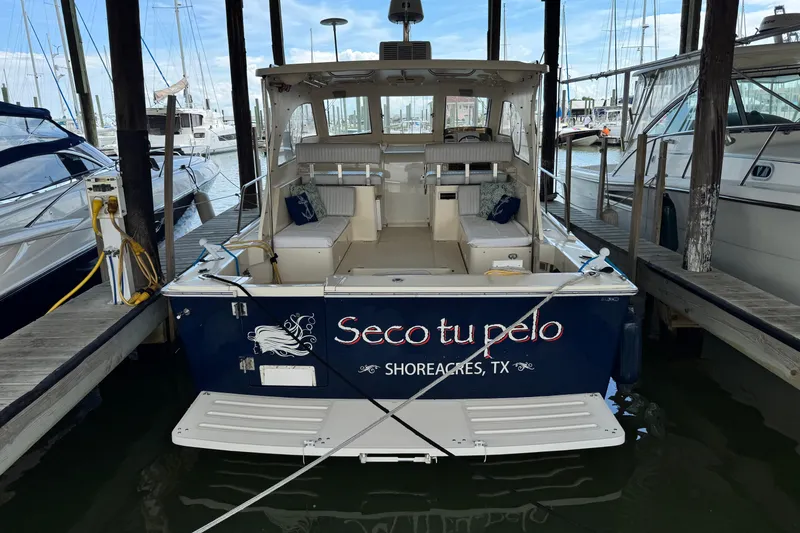 Slide: The Image of 2003 Mainship Pilot 34 docked in Shoreacres, TX marina. - 2