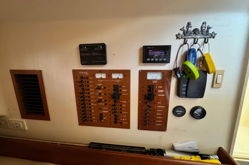 Slide: The Image of Electrical control panel of a 2003 Mainship Pilot 34 boat interior. - 27