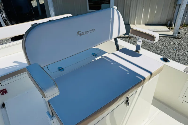 Slide: The Image of 2023 Banks Panga 23 Center Console boat seat with armrests and storage compartment. - 13