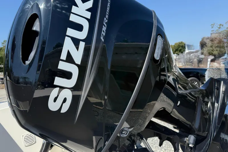 Slide: The Image of Close-up of Suzuki outboard motor on 2023 Banks Panga 23 Center Console boat. - 18