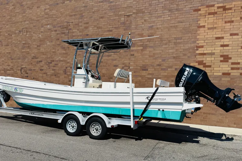 Slide: The Image of 2023 Banks Panga 26 Center Console boat on trailer, parked by brick wall. - 24