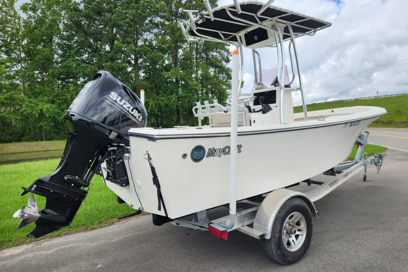 Slide: The Image of 2023 May-Craft 1900CC boat on trailer with Suzuki outboard motor. - 2